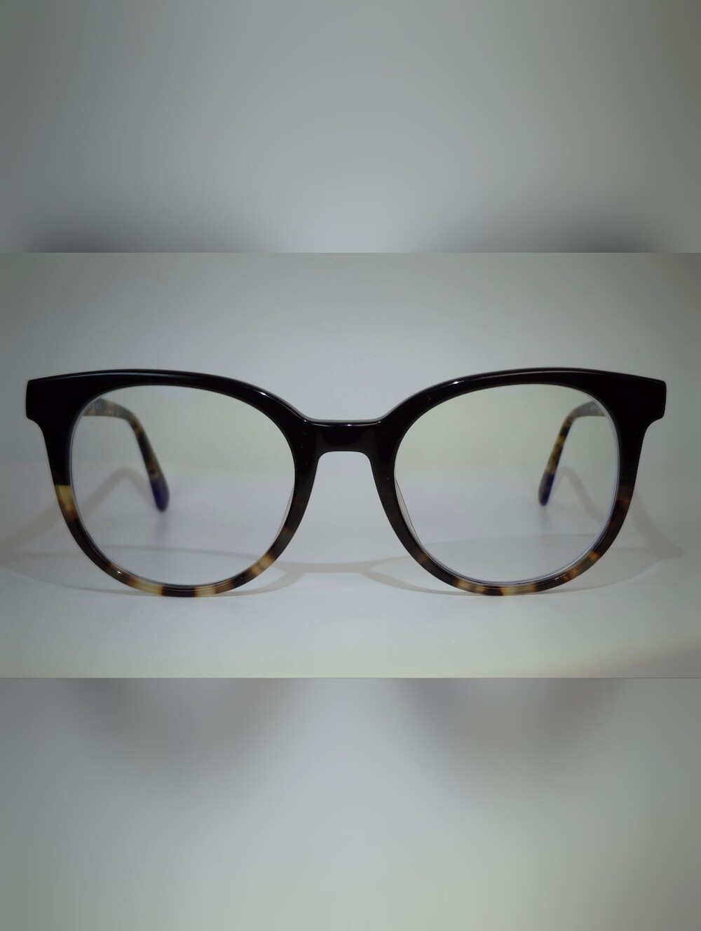 Rialto. Classic Round Black Upper, Animal Print Lower And Temples.